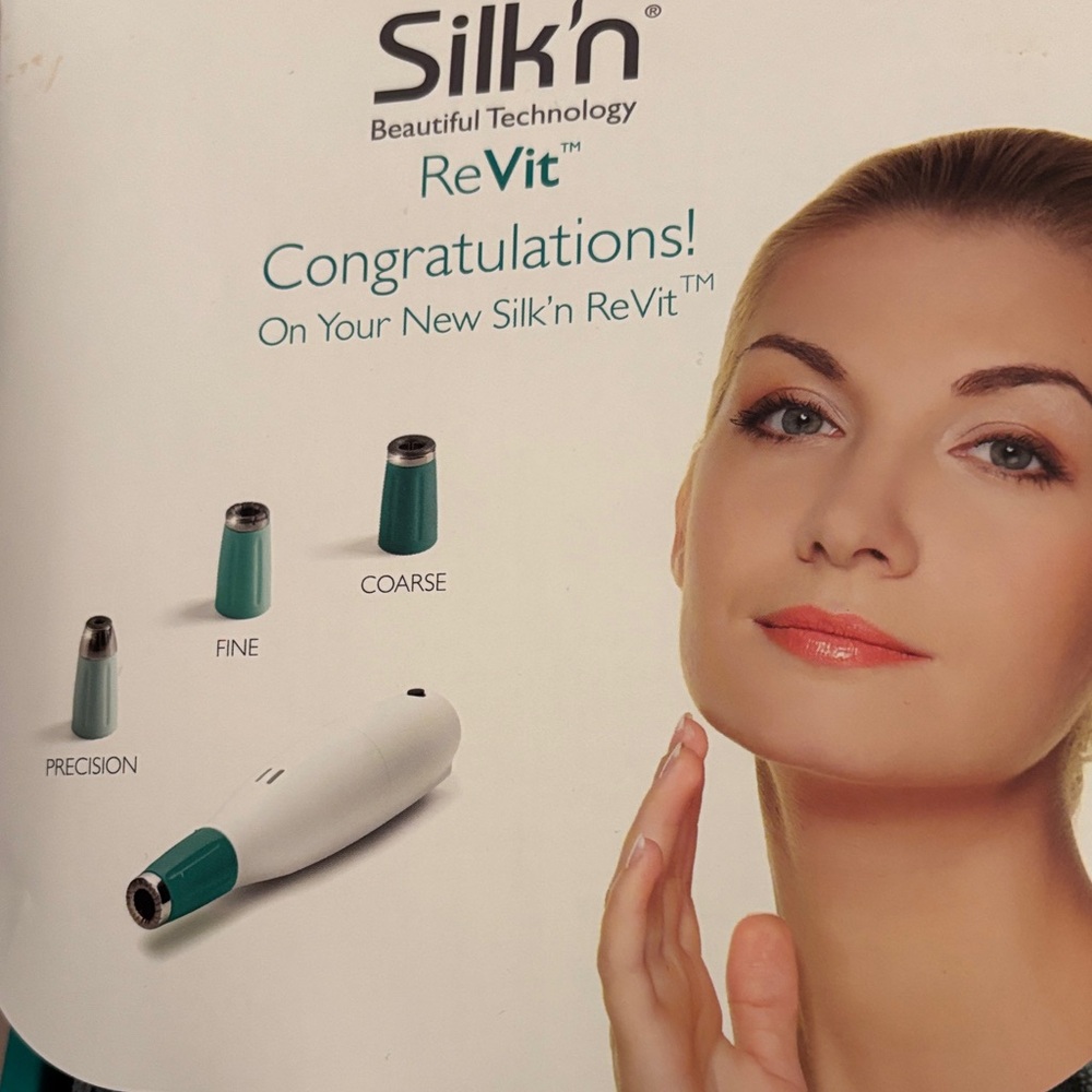 ReVit Women’s Skincare Device in Teal and White